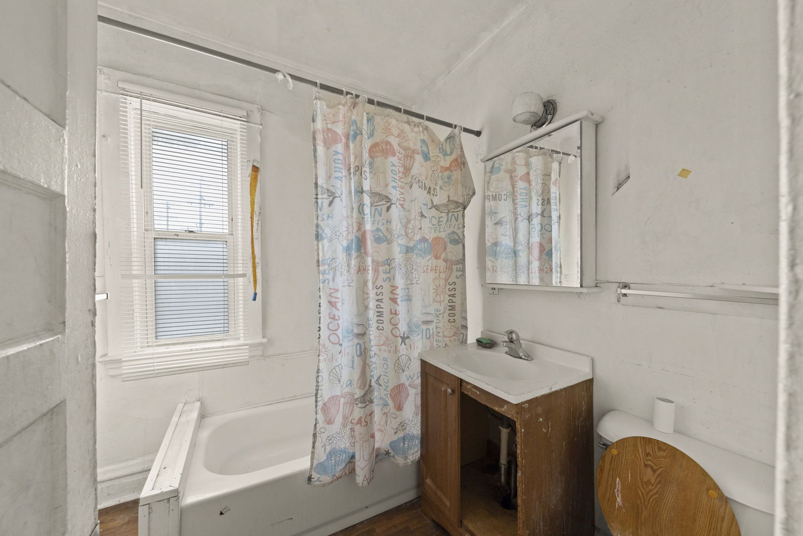 910 St Charles Road Maywood, IL 60153 - Photo 7 of 13 a bathroom with a sink and a mirror