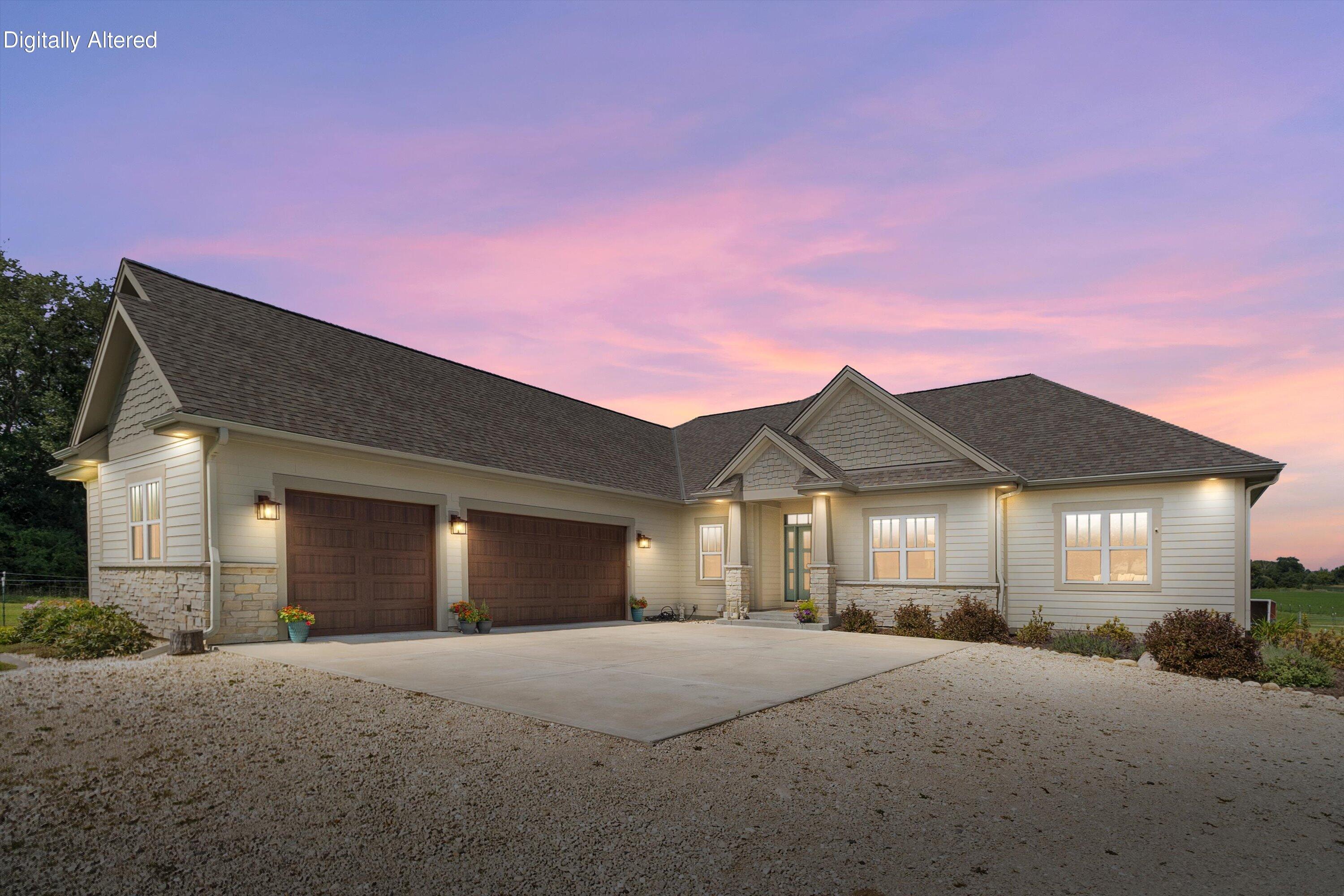 S75W35724 Wilton Road Eagle, WI 53119 - Photo 63 of 63 Canned lights installed throughout the exterior - home sparkles at night. Photo is Digitally Altered - Twilight Sunset.