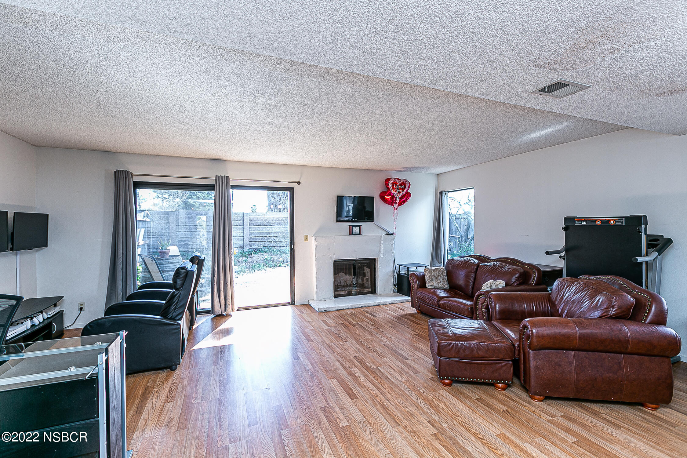 1210 East Foster Road, Unit B Santa Maria, CA 93455 - Photo 11 of 30 a living room with furniture and a fireplace