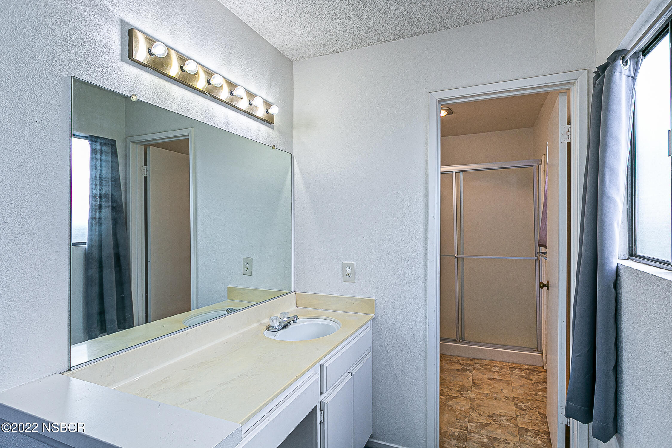 1210 East Foster Road, Unit B Santa Maria, CA 93455 - Photo 15 of 30 a en suite bathroom with a sink and a mirror