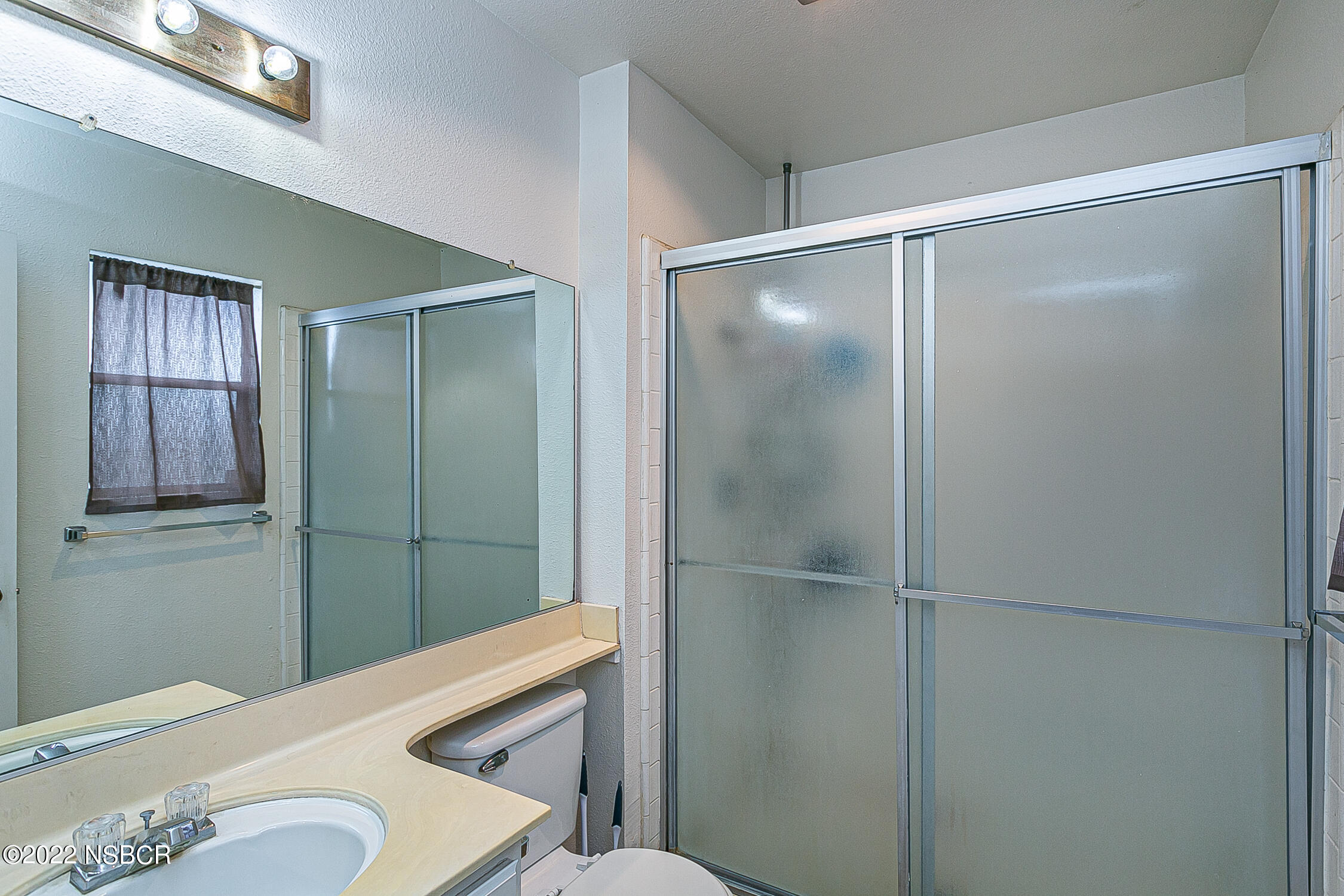 1210 East Foster Road, Unit B Santa Maria, CA 93455 - Photo 16 of 30 a bathroom with a shower and a sink