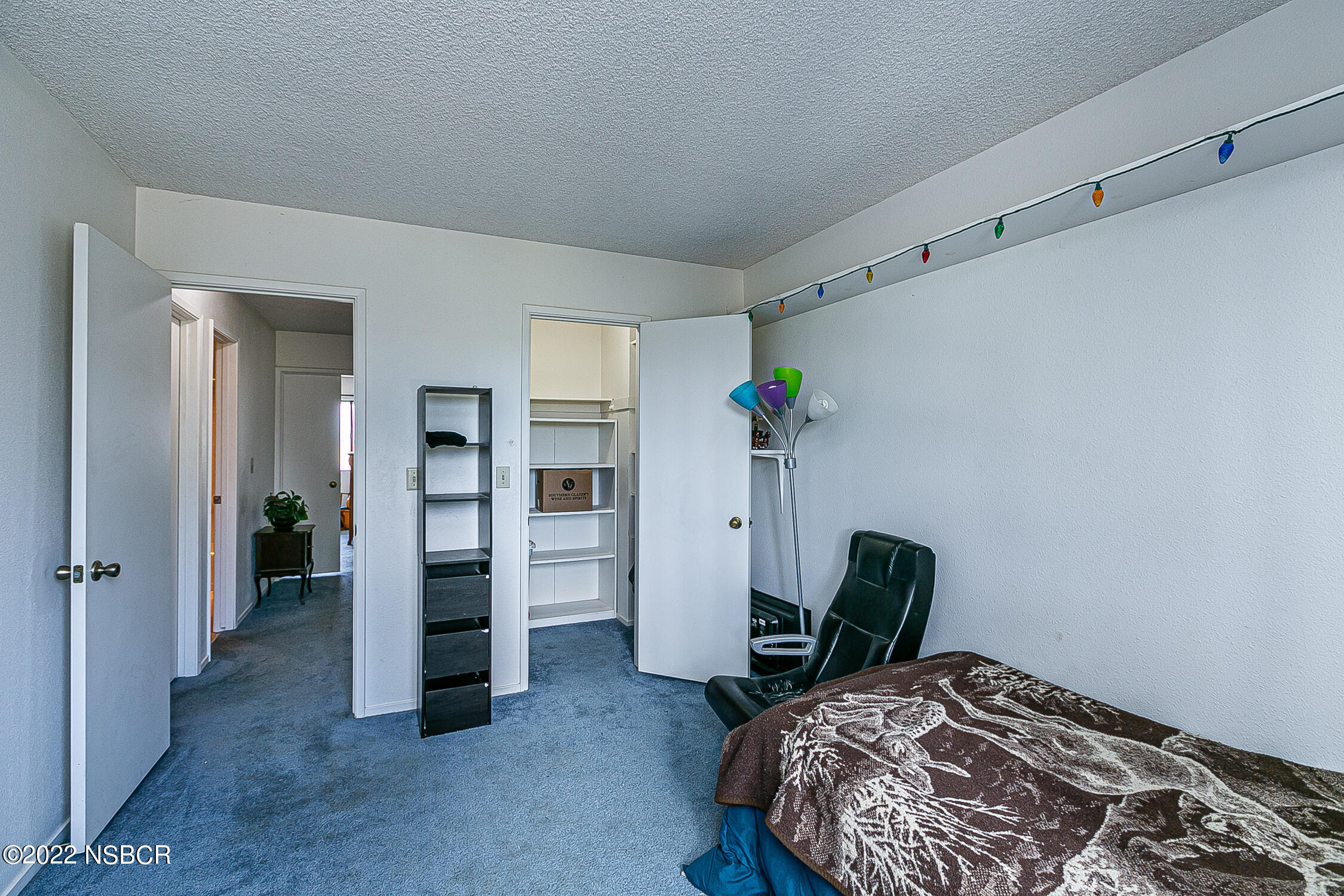 1210 East Foster Road, Unit B Santa Maria, CA 93455 - Photo 18 of 30 a bedroom with a bed and furniture