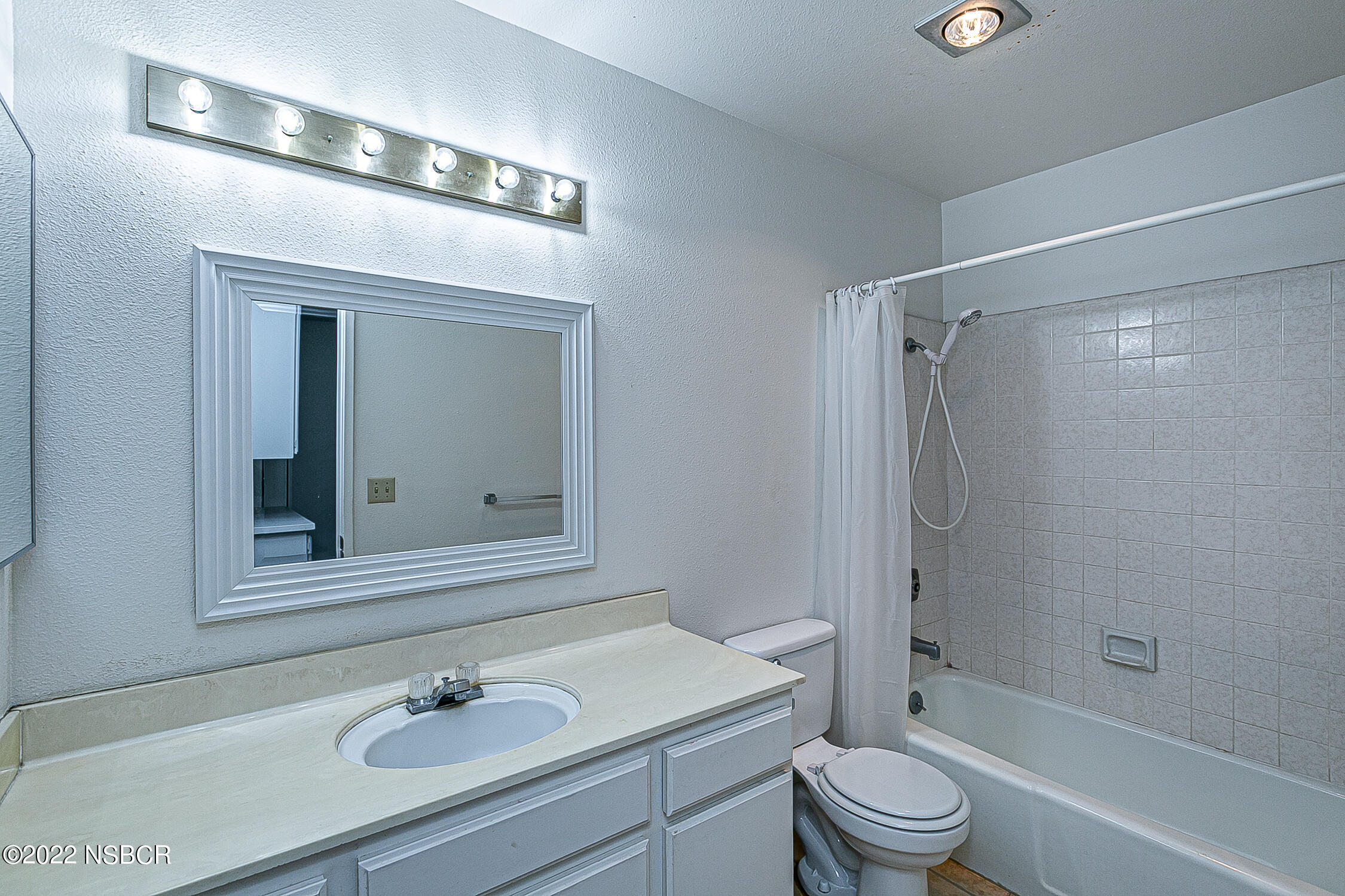 1210 East Foster Road, Unit B Santa Maria, CA 93455 - Photo 19 of 30 a bathroom with a sink a toilet and shower