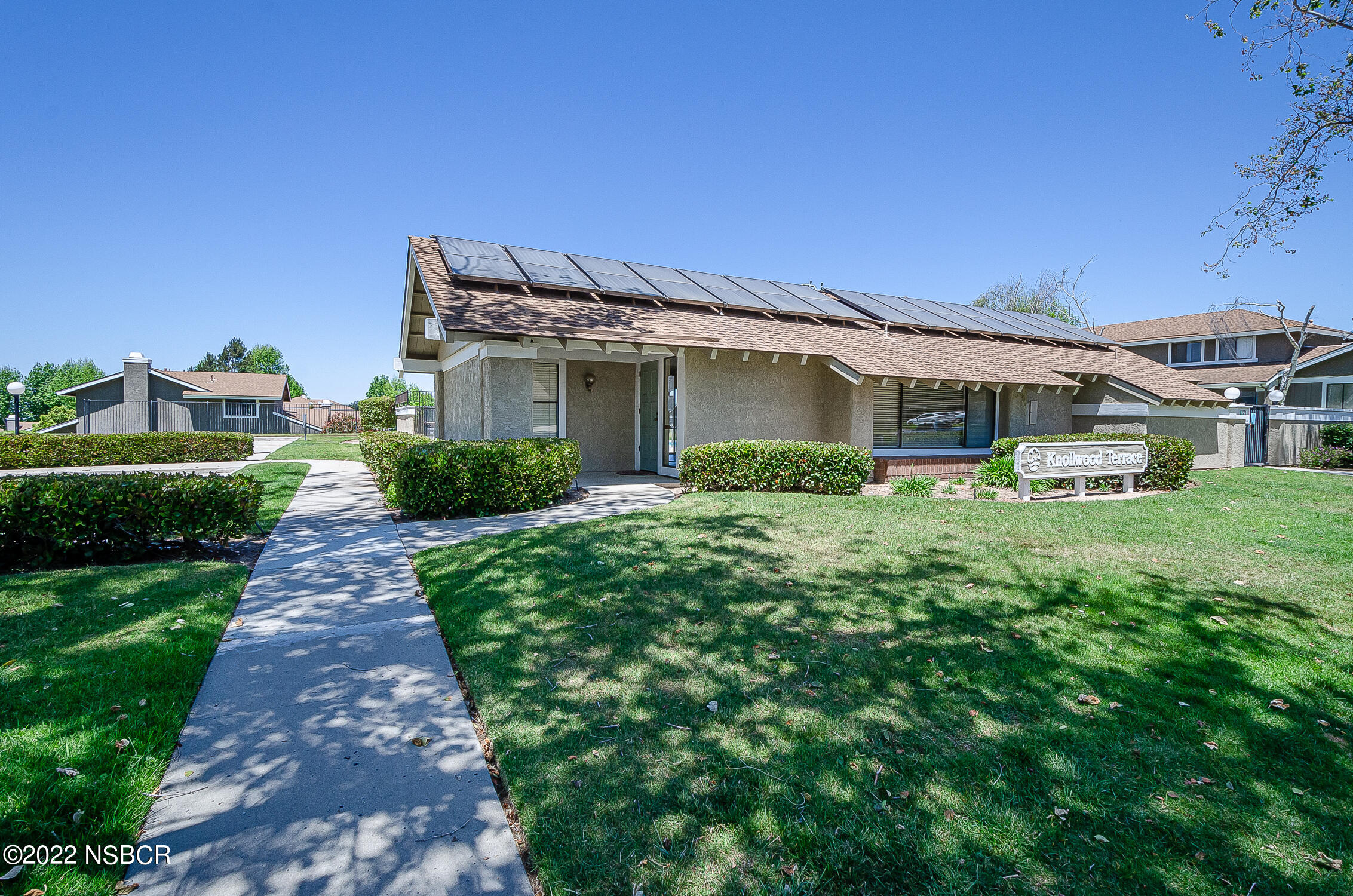 1210 East Foster Road, Unit B Santa Maria, CA 93455 - Photo 2 of 30 a front view of a house with yard and green space
