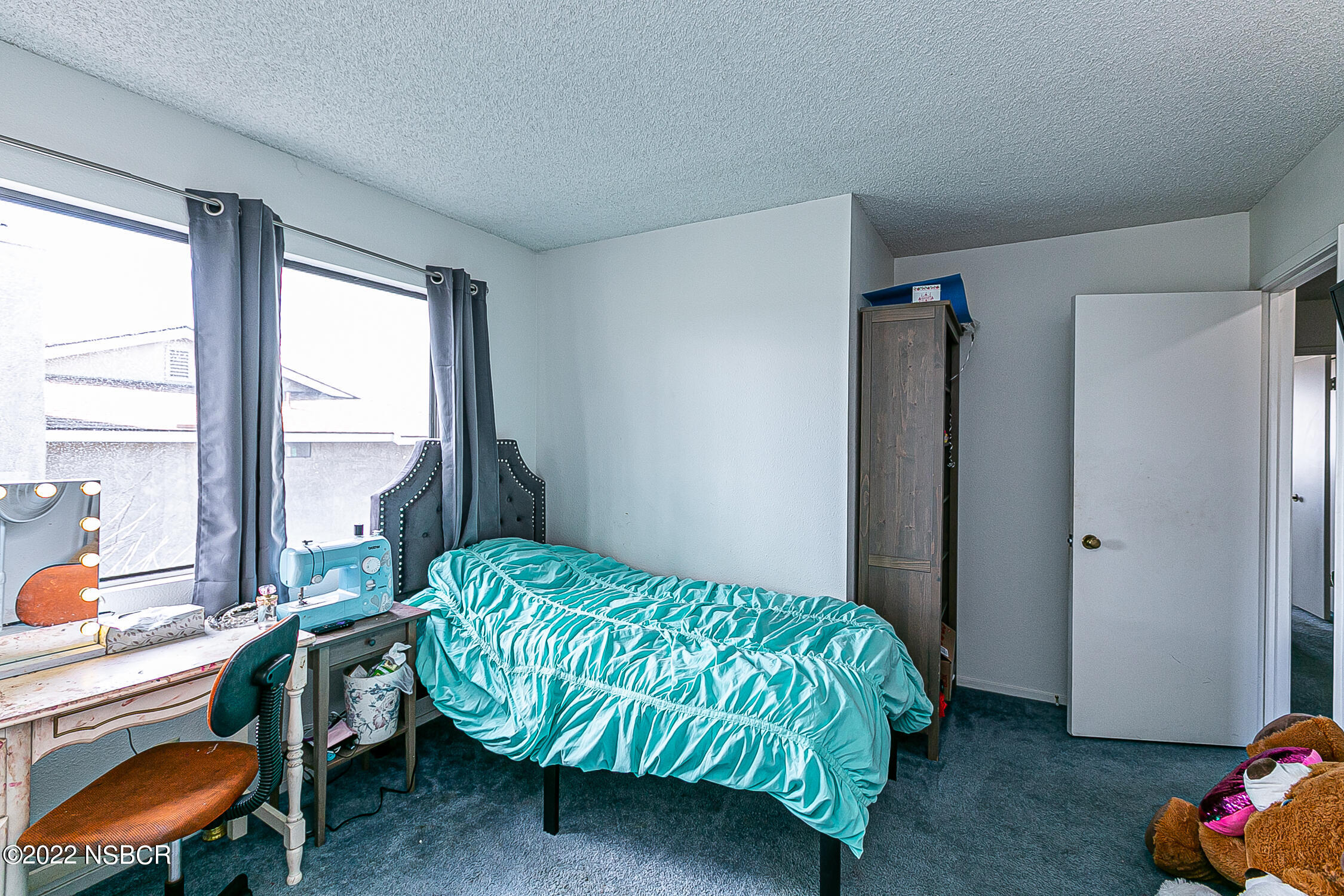 1210 East Foster Road, Unit B Santa Maria, CA 93455 - Photo 21 of 30 a bedroom with a bed and a window