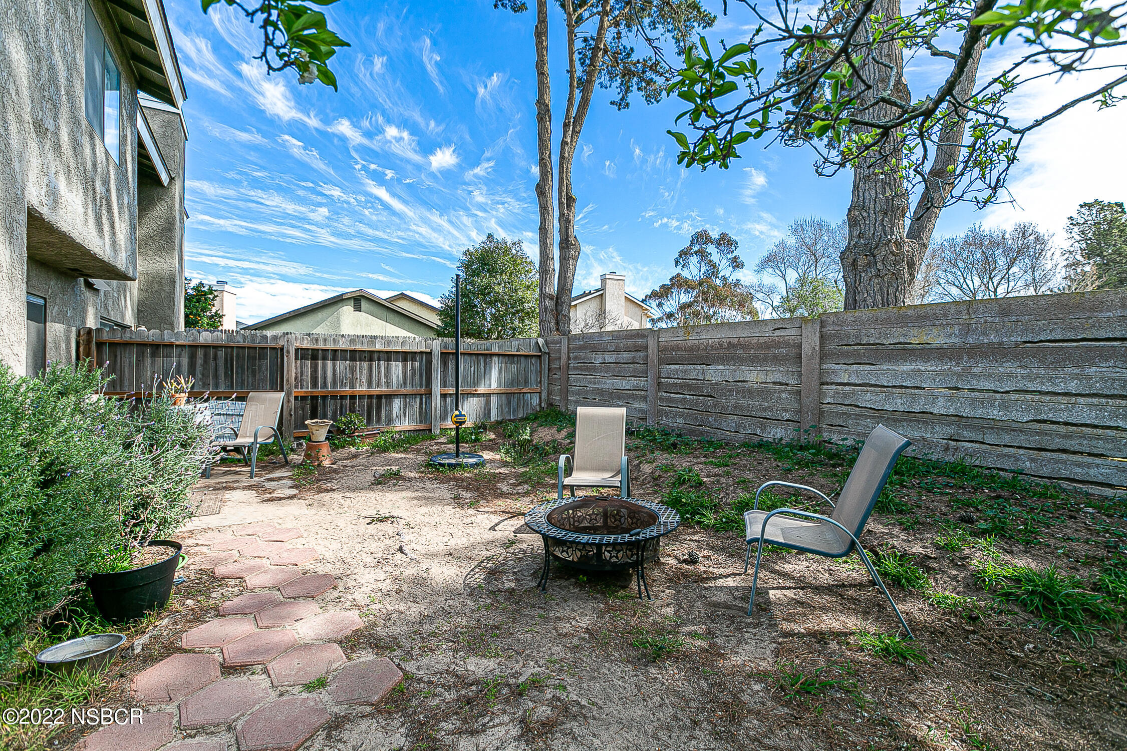 1210 East Foster Road, Unit B Santa Maria, CA 93455 - Photo 26 of 30 a view of a chair and table in backyard