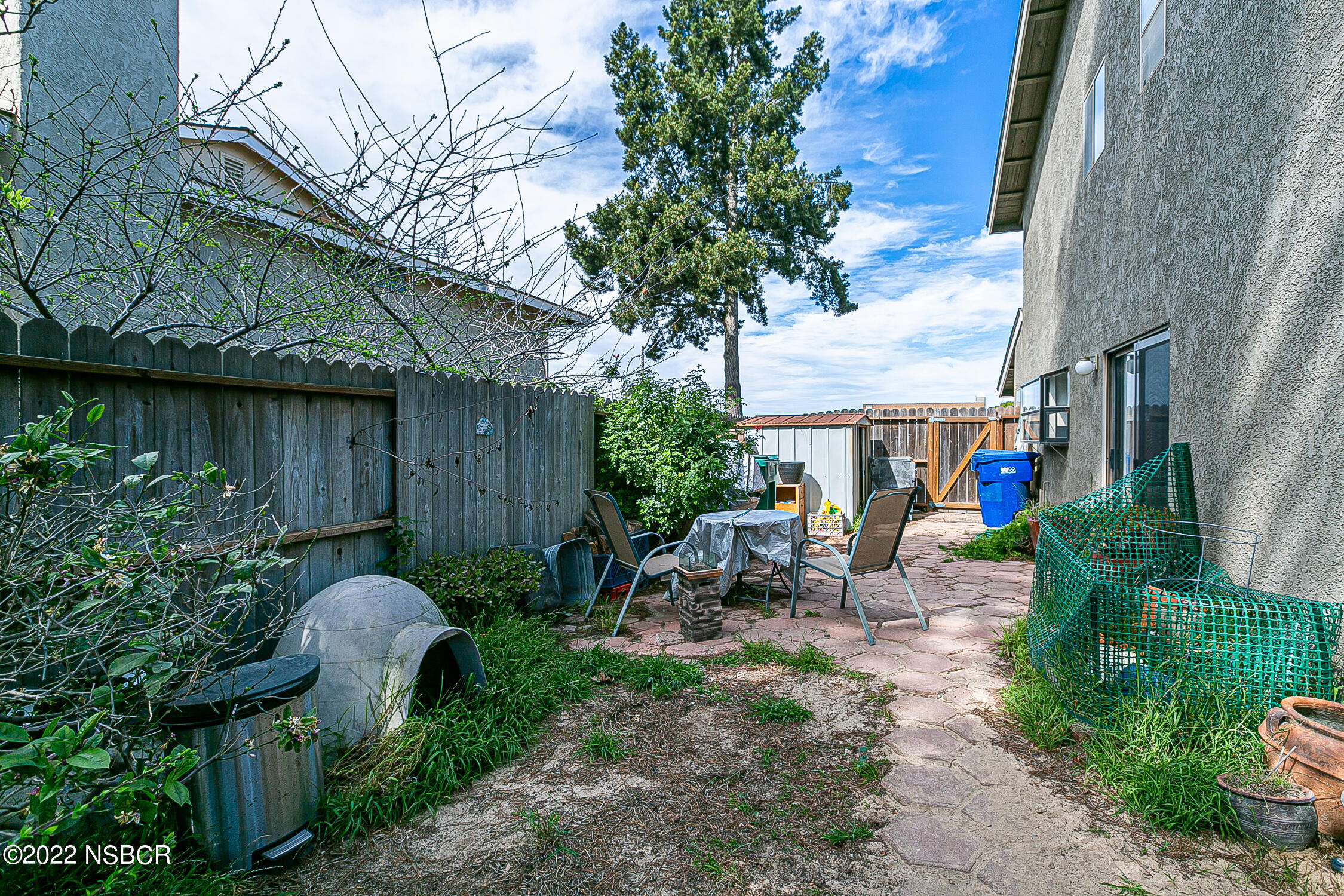 1210 East Foster Road, Unit B Santa Maria, CA 93455 - Photo 28 of 30 a backyard of a house with wooden fence and plants