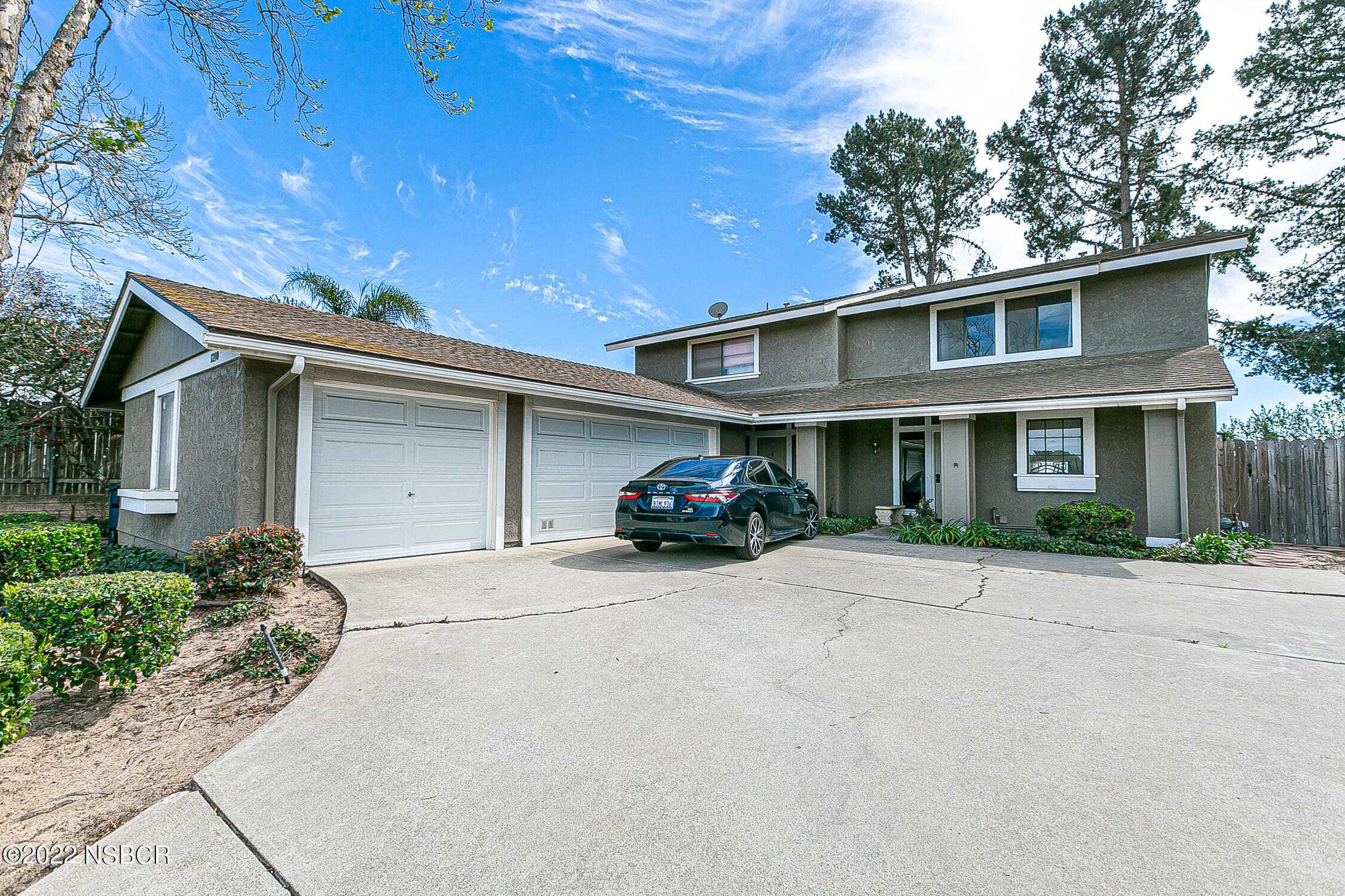 1210 East Foster Road, Unit B Santa Maria, CA 93455 - Photo 3 of 30 a front view of a house with garden