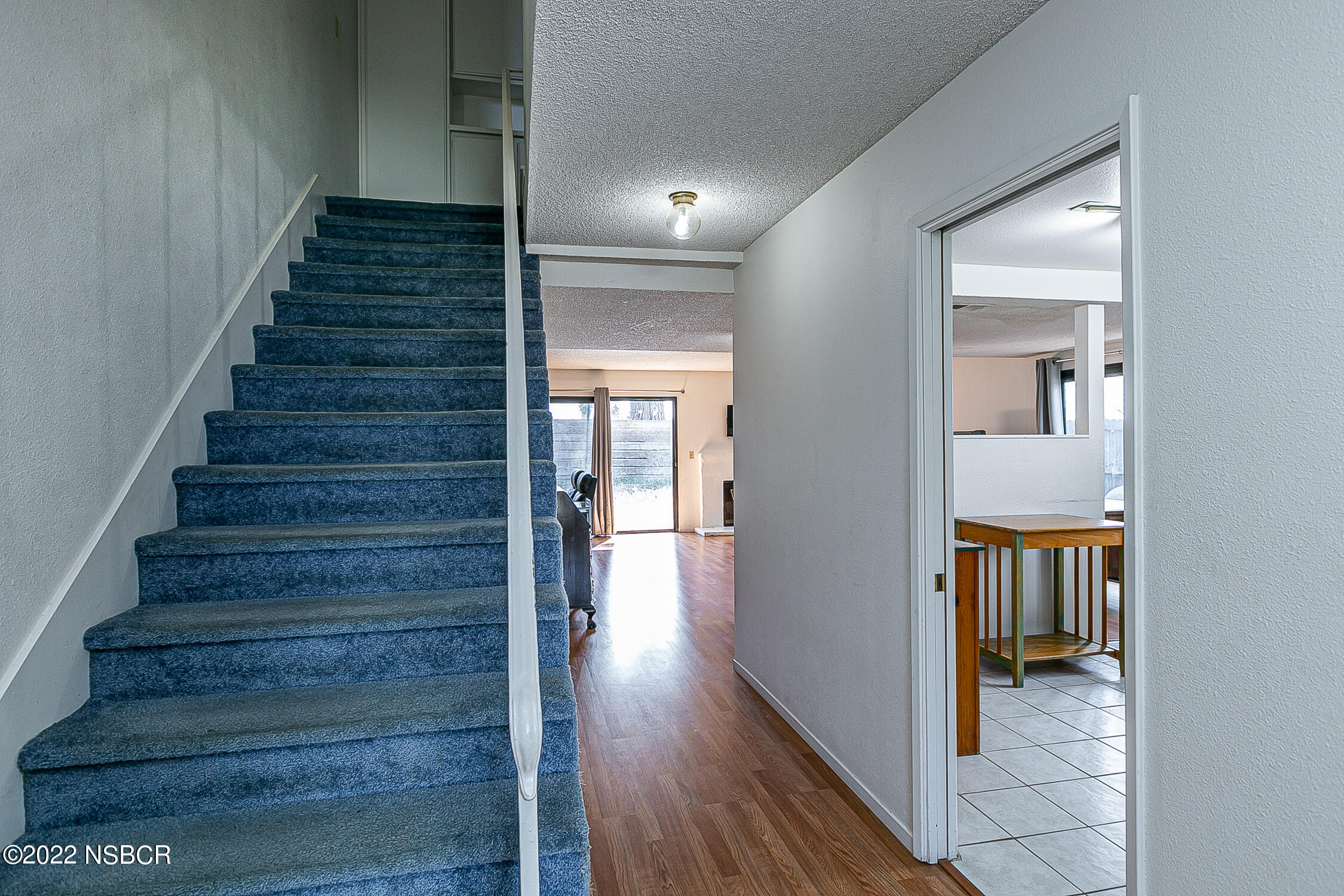 1210 East Foster Road, Unit B Santa Maria, CA 93455 - Photo 5 of 30 a view of a hallway with wooden floor and entryway