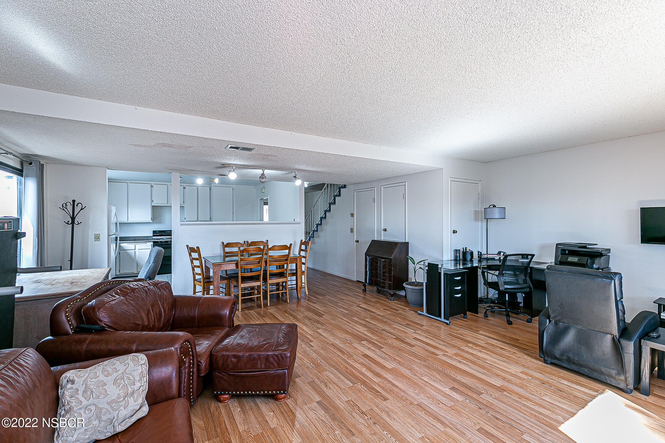 1210 East Foster Road, Unit B Santa Maria, CA 93455 - Photo 9 of 30 a living room with furniture and wooden floor