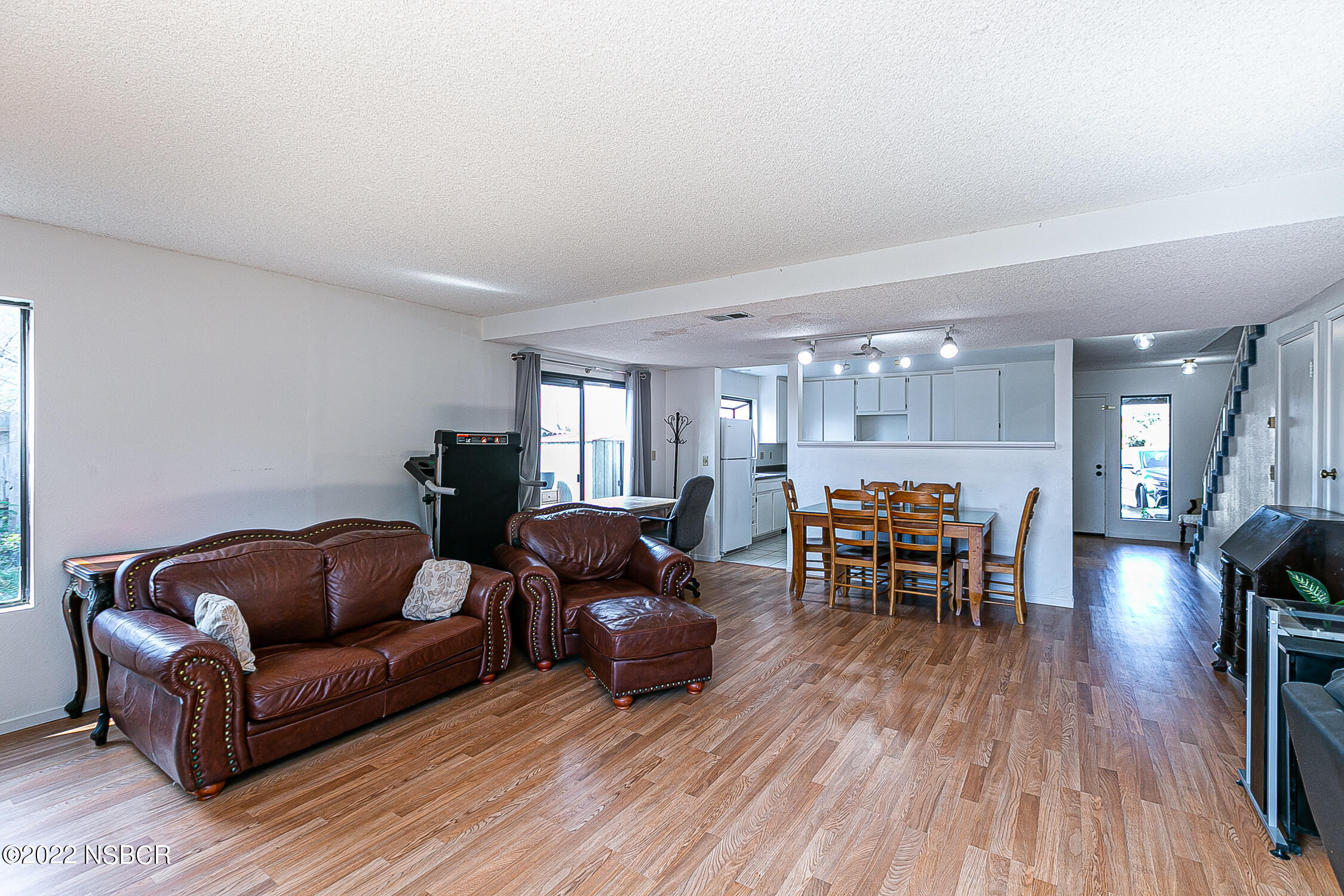 1210 East Foster Road, Unit B Santa Maria, CA 93455 - Photo 10 of 30 a living room with furniture and a wooden floor