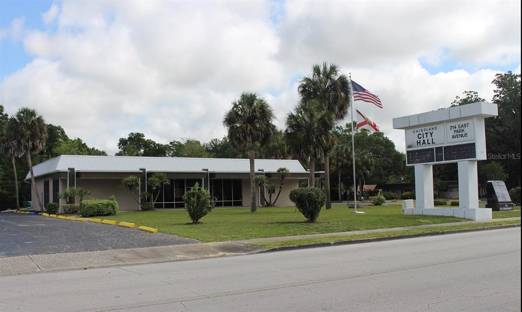 Tbd Chiefland, FL 32626 - Photo 4 of 4 a view of a white house with a sink and a yard with plants