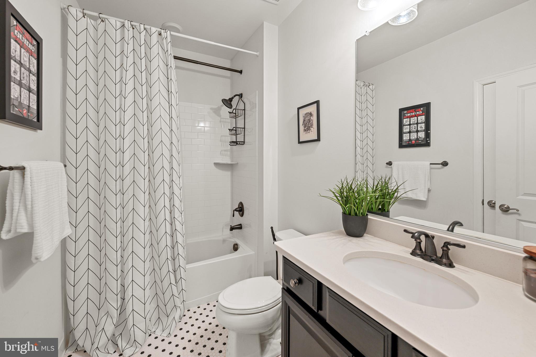 8459 Reformatory Way Lorton, VA 22079 - Photo 49 of 78 a bathroom with a sink toilet and shower