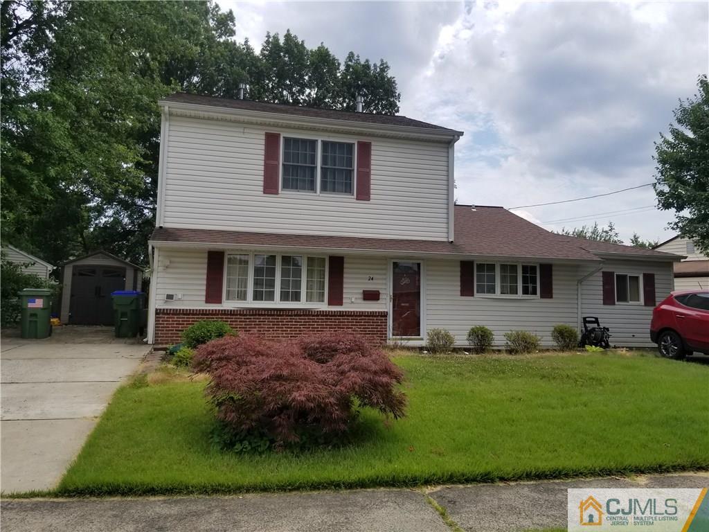 24 Fairfax Road Edison, NJ 08817 - Photo 1 of 4 a front view of a house with a yard and porch