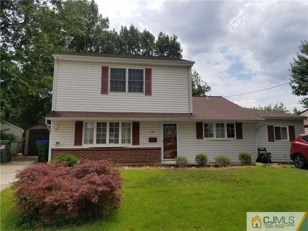 24 Fairfax Road Edison, NJ 08817 - Photo 3 of 4 a front view of a house with a garden