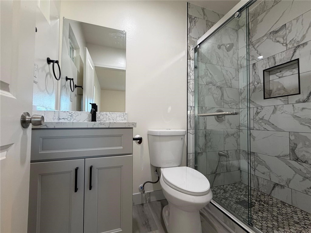 1316 Walnut Street San Gabriel, CA 91776 - Photo 11 of 19 a bathroom with a sink toilet and shower