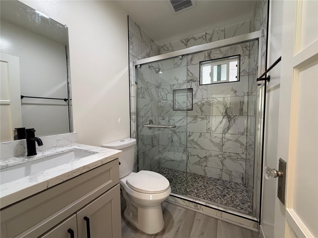 1316 Walnut Street San Gabriel, CA 91776 - Photo 6 of 19 a bathroom with a sink a toilet and shower