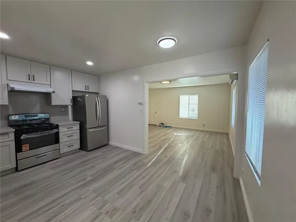 a view of a livingroom with wooden floor