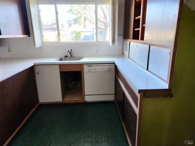 a bathroom with a sink and a window