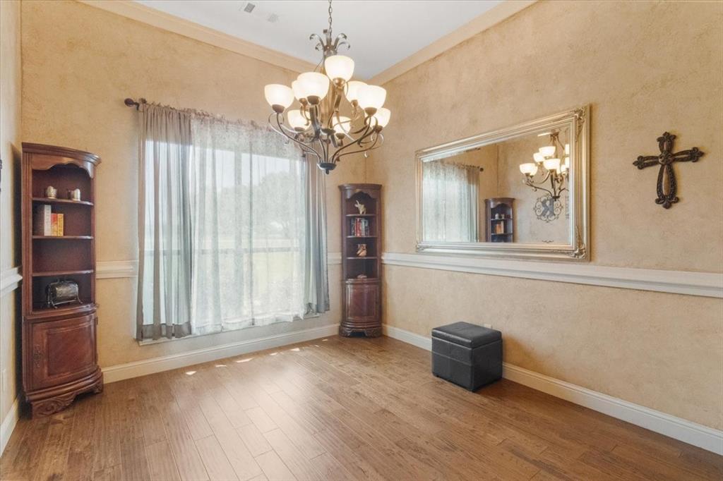 120 Trail Ridge Weatherford, TX 76087 - Photo 13 of 37 Dining area to left of entry foyer, with a chandelier, wood finished flooring.