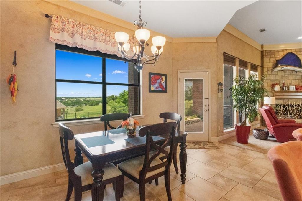 120 Trail Ridge Weatherford, TX 76087 - Photo 28 of 37 Dining area featuring a chandelier, and light tile patterned flooring