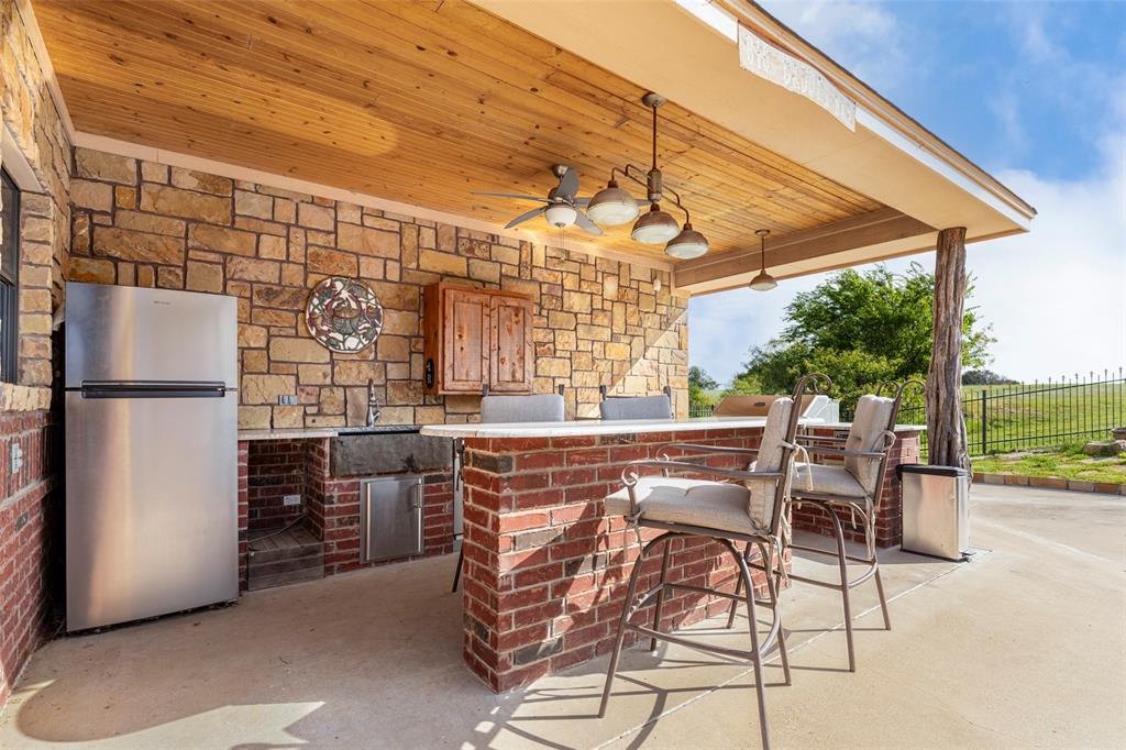 120 Trail Ridge Weatherford, TX 76087 - Photo 8 of 37 Outdoor kitchen with bar area