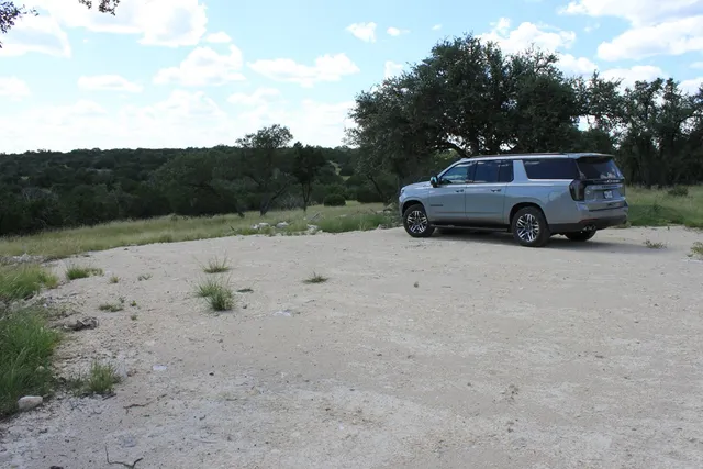 a view of a car parked in a field