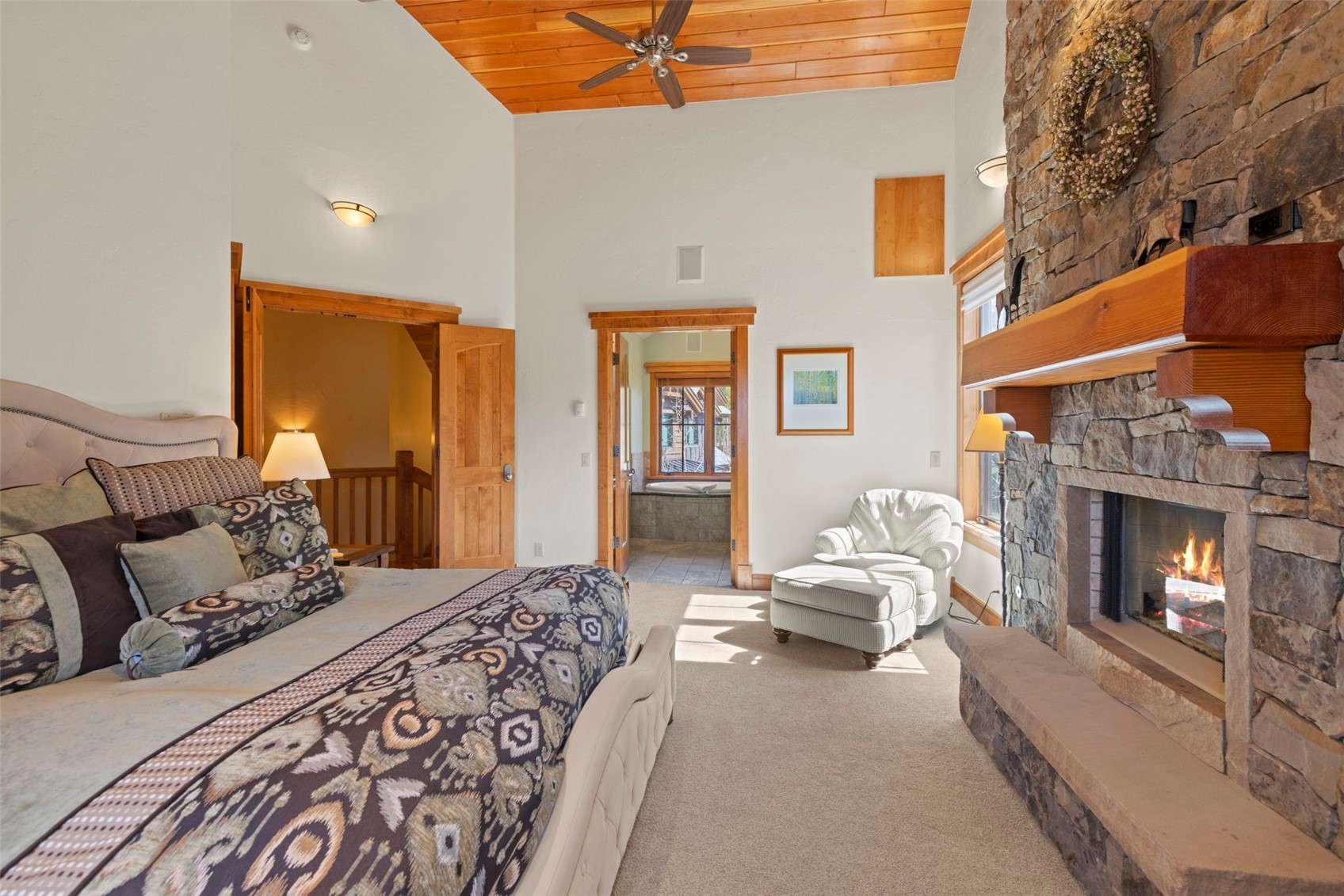 317 Timbertrail Road Breckenridge, CO 80424 - Photo 35 of 50 a bedroom with a bed and fireplace