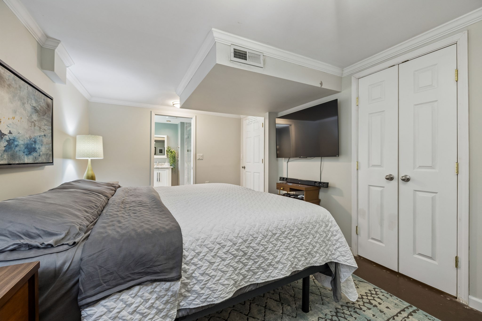 518 Ridgemont Drive Dickson, TN 37055 - Photo 39 of 67 a bedroom with a bed and a flat screen tv