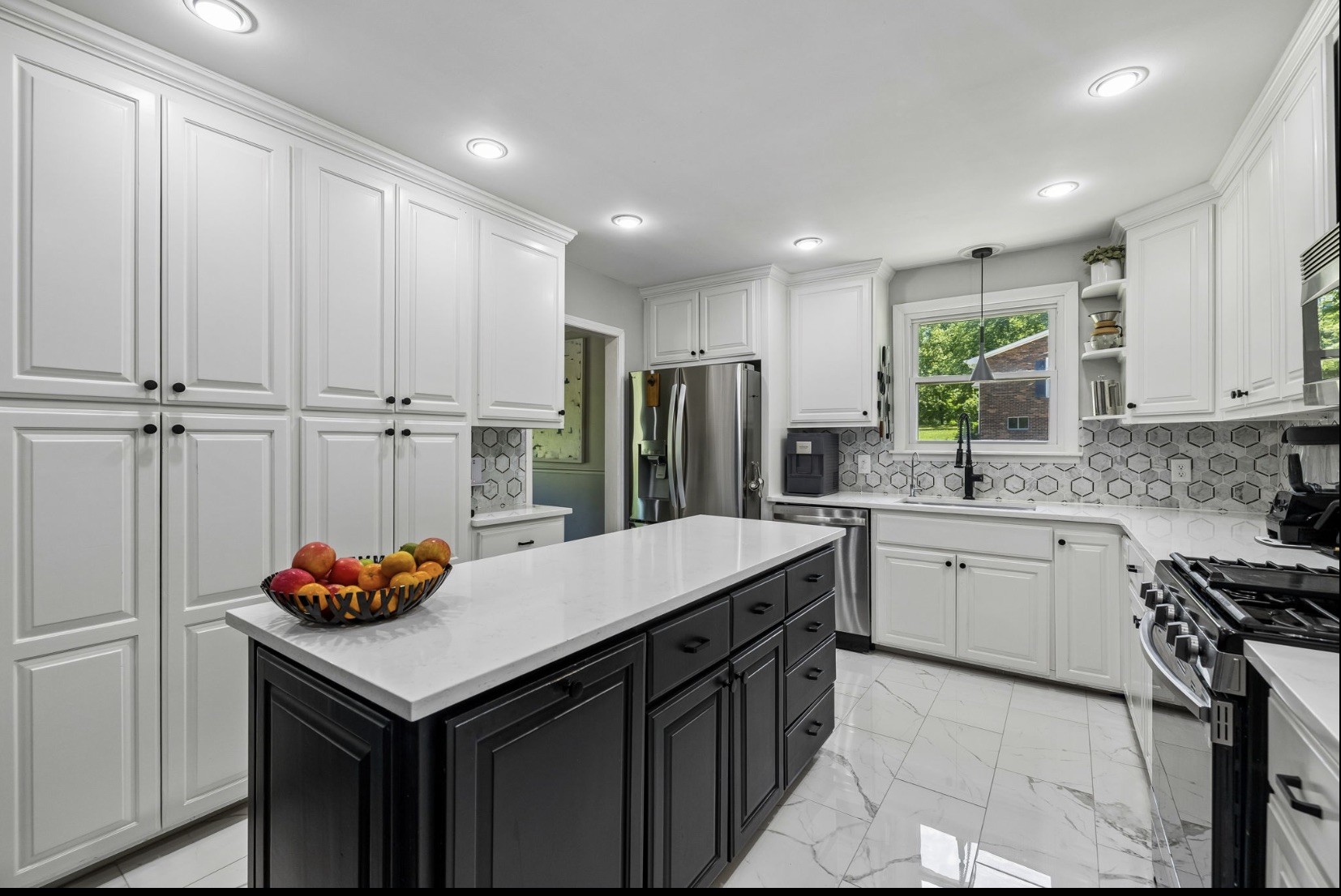 518 Ridgemont Drive Dickson, TN 37055 - Photo 6 of 67 a kitchen with stainless steel appliances granite countertop a sink dishwasher and a refrigerator with wooden cabinets