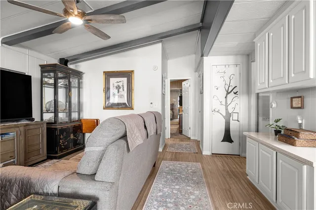 a bedroom with a bed and a mirror