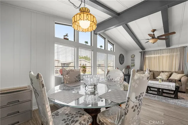 a kitchen with stainless steel appliances granite countertop a sink refrigerator and cabinets