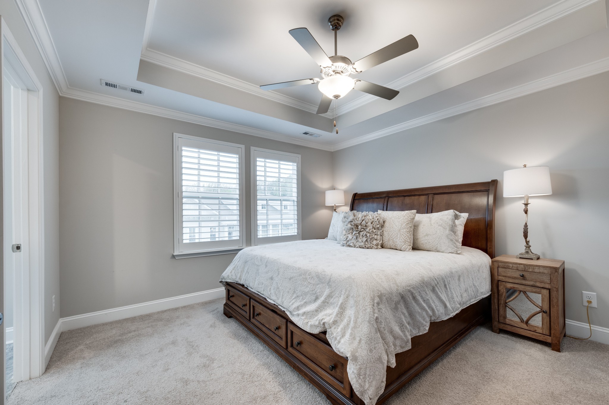 3106 Patcham Drive Nolensville, TN 37135 - Photo 11 of 26 a bedroom with a large bed and a chandelier