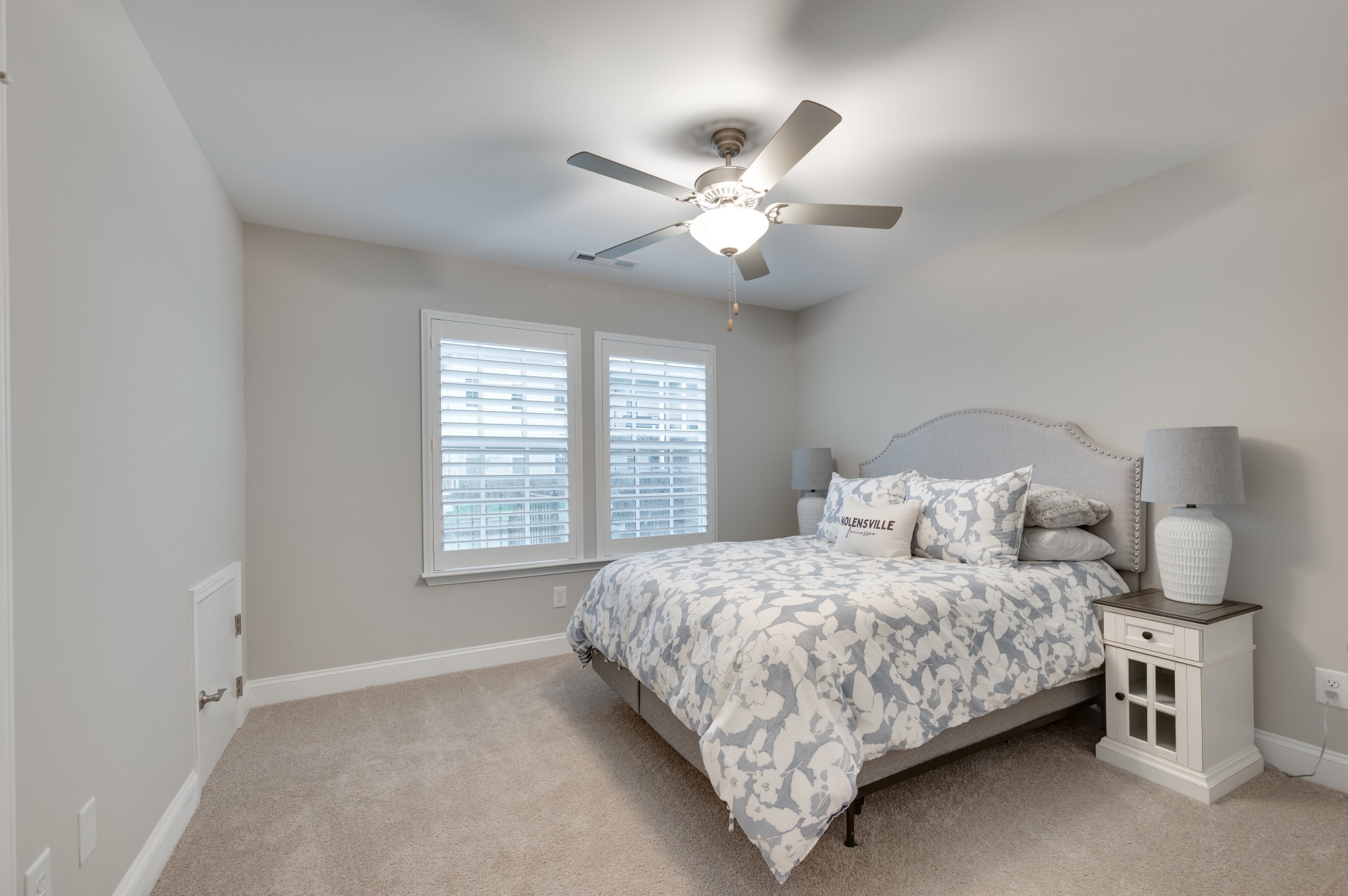 3106 Patcham Drive Nolensville, TN 37135 - Photo 14 of 26 a bedroom with a large bed and a chandelier