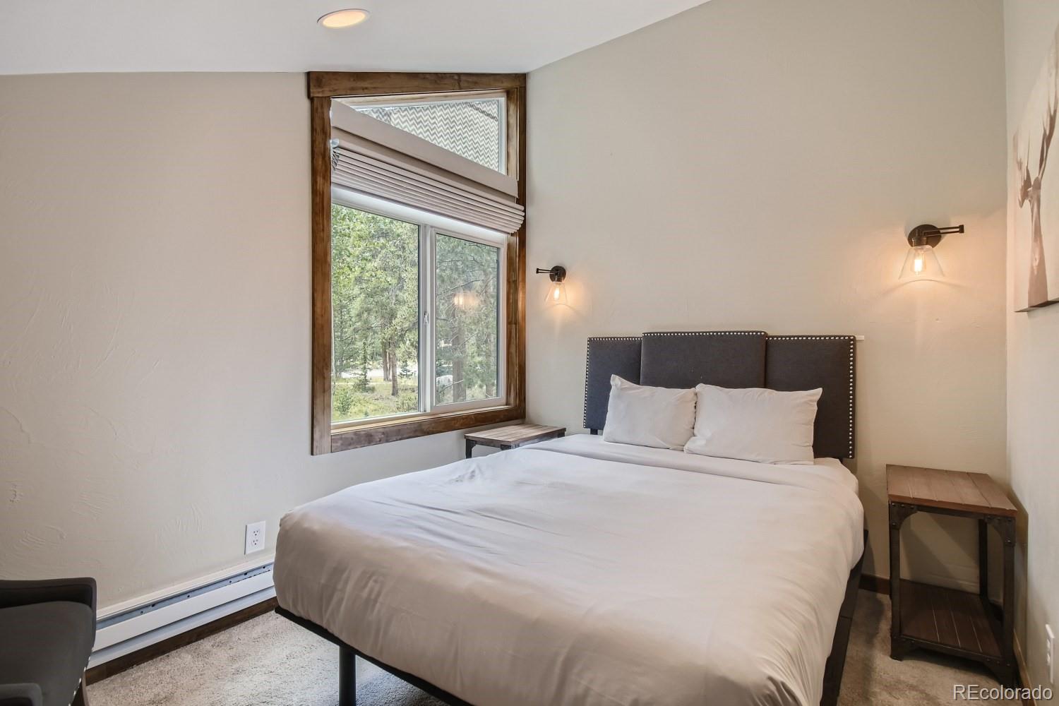 1937 Soda Ridge Road, Unit 1153/1154 Dillon, CO 80435 - Photo 11 of 17 a bedroom with a bed and a window