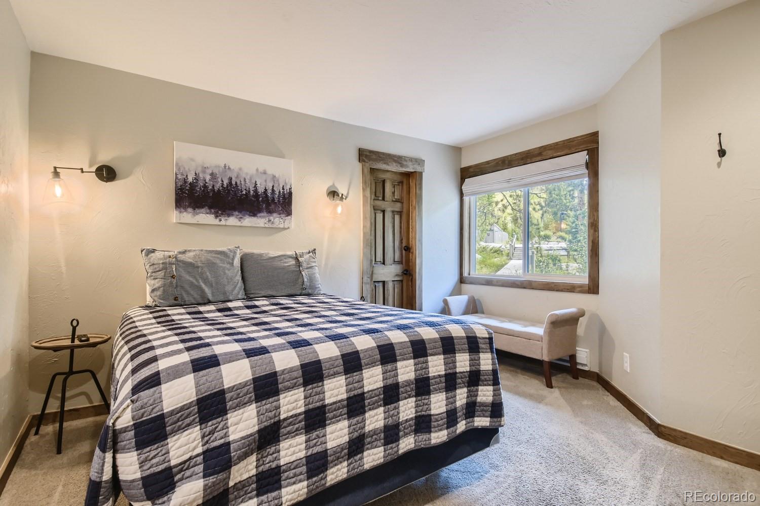 1937 Soda Ridge Road, Unit 1153/1154 Dillon, CO 80435 - Photo 7 of 17 a bedroom with a bed and a window