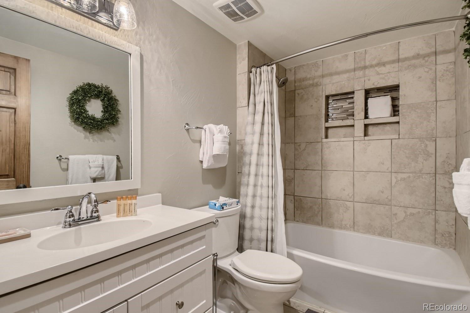 1937 Soda Ridge Road, Unit 1153/1154 Dillon, CO 80435 - Photo 10 of 17 a bathroom with a sink a toilet and shower