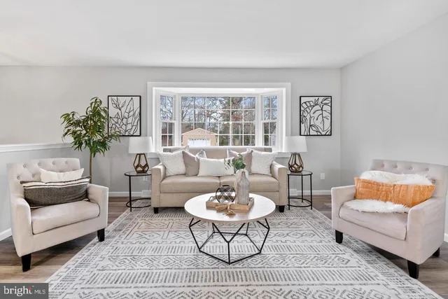a living room with furniture and a rug