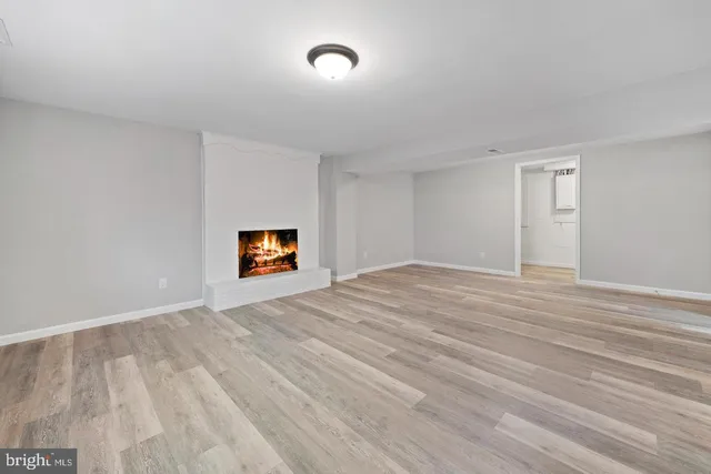 a view of room with wooden floor and window