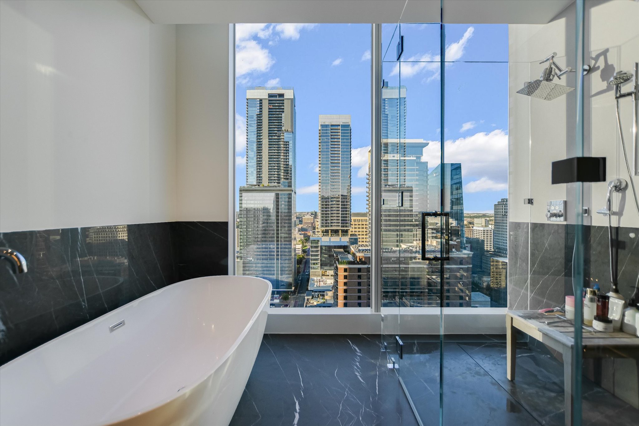 210 Lavaca Street, Unit 3108 Austin, TX 78701 - Photo 24 of 34 a bathroom with a bathtub a sink and shower