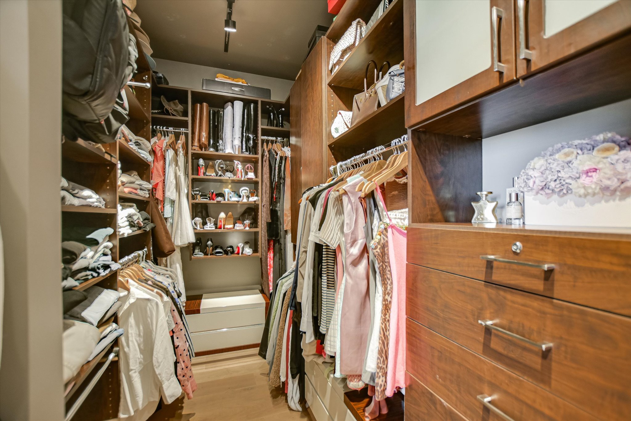 210 Lavaca Street, Unit 3108 Austin, TX 78701 - Photo 26 of 34 a view of walk in closet with clothes and shoes
