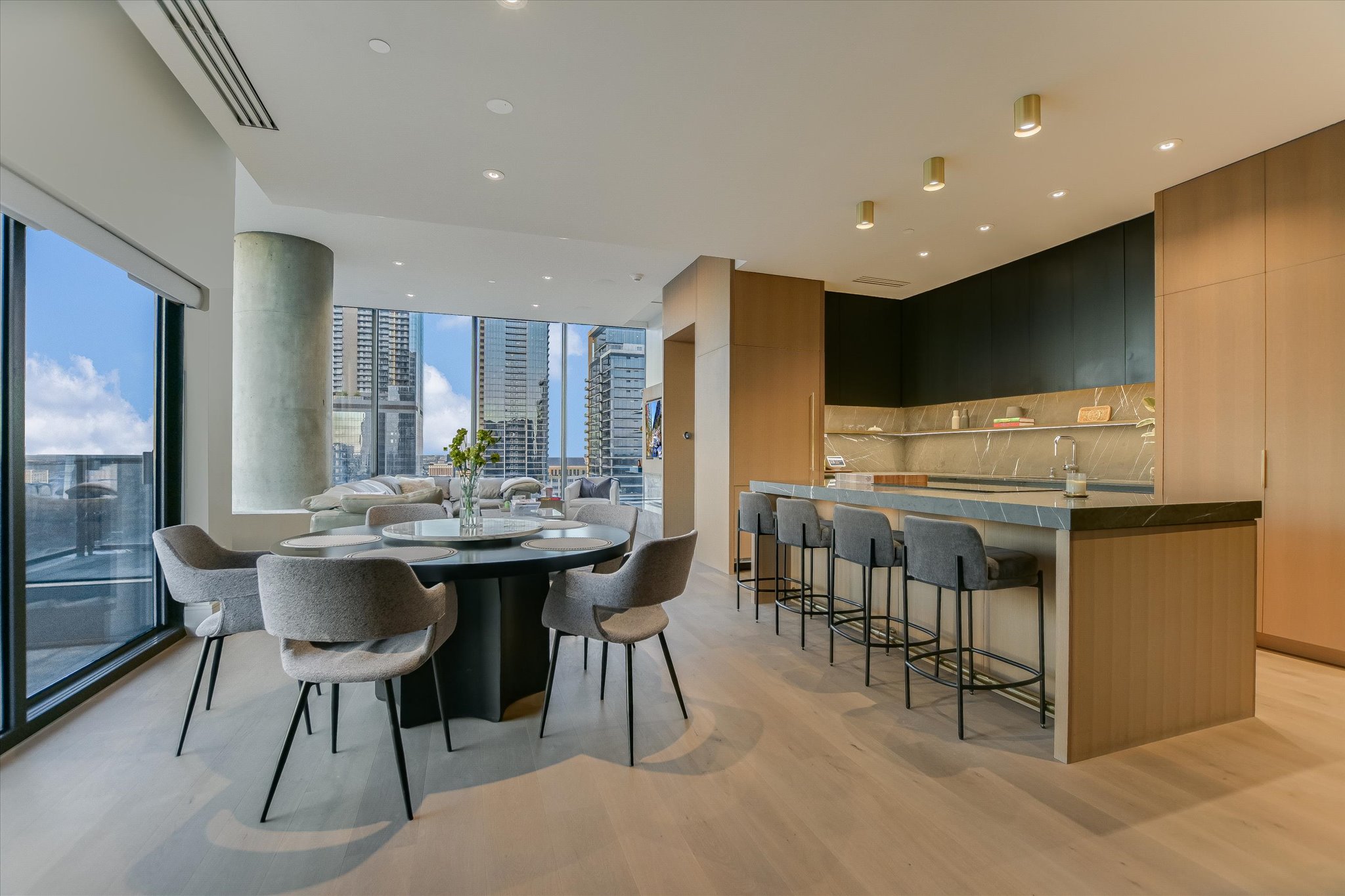 210 Lavaca Street, Unit 3108 Austin, TX 78701 - Photo 10 of 34 a kitchen with a table chairs and a refrigerator