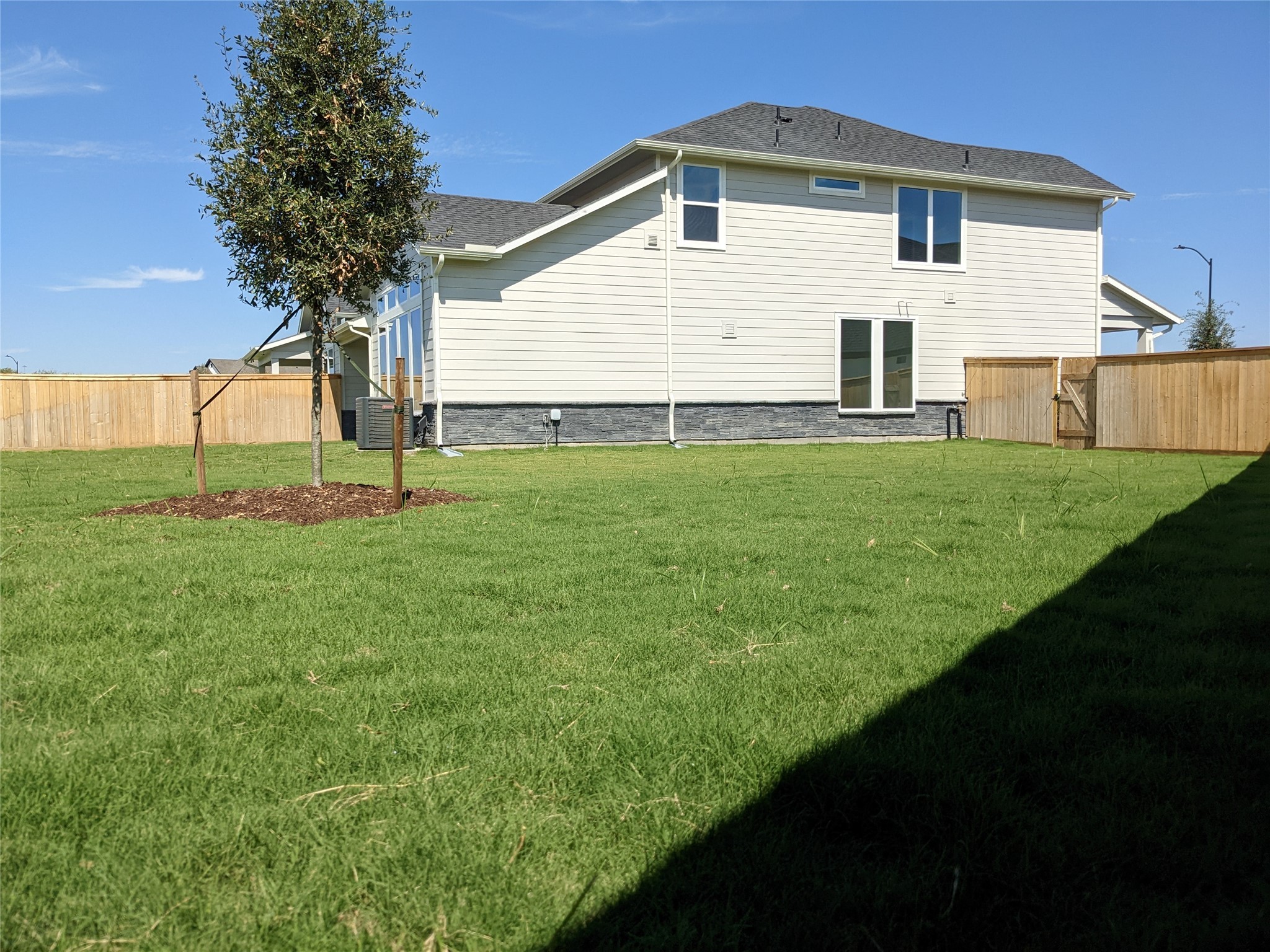 15311 Leal Rancho Court Cypress, TX 77433 - Photo 11 of 20 a view of a backyard of the house