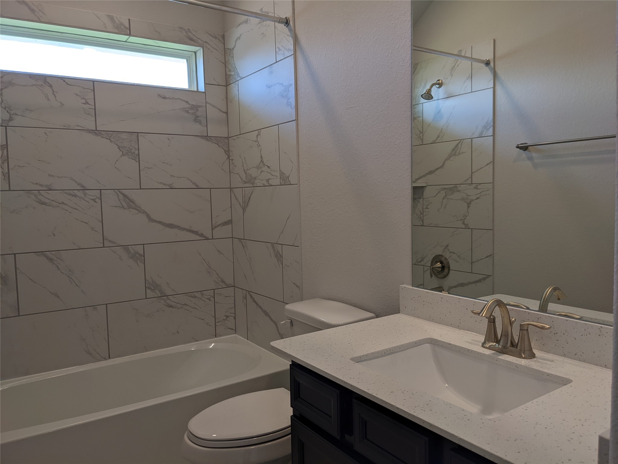 15311 Leal Rancho Court Cypress, TX 77433 - Photo 17 of 20 a bathroom with a sink toilet vanity and bathtub