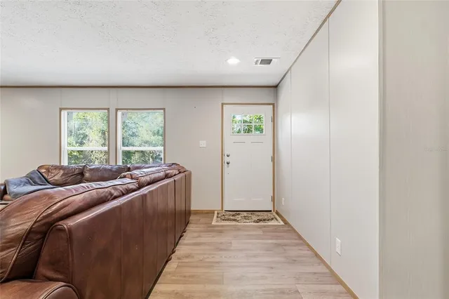 a bed room with a bed and a window