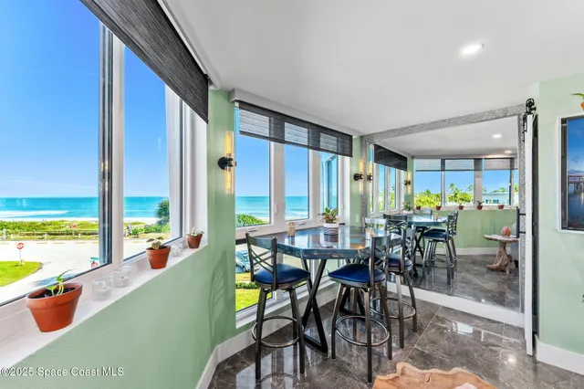 a view of a dining room with furniture window and outside view
