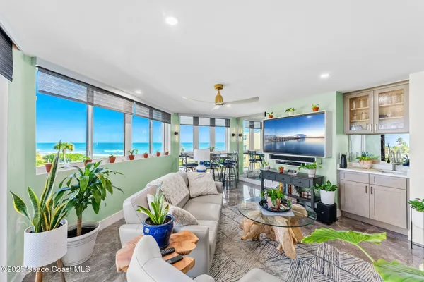 a living room with lots of furniture and a table