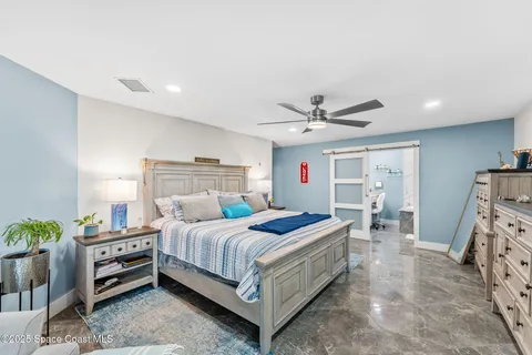 a view of a house with potted plants