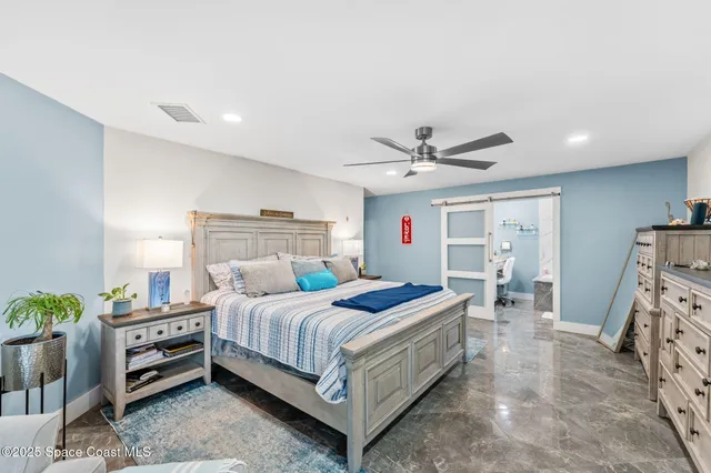 a view of a house with potted plants