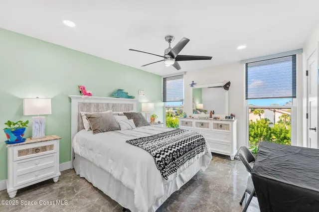 a view of a patio with table and chairs potted plants